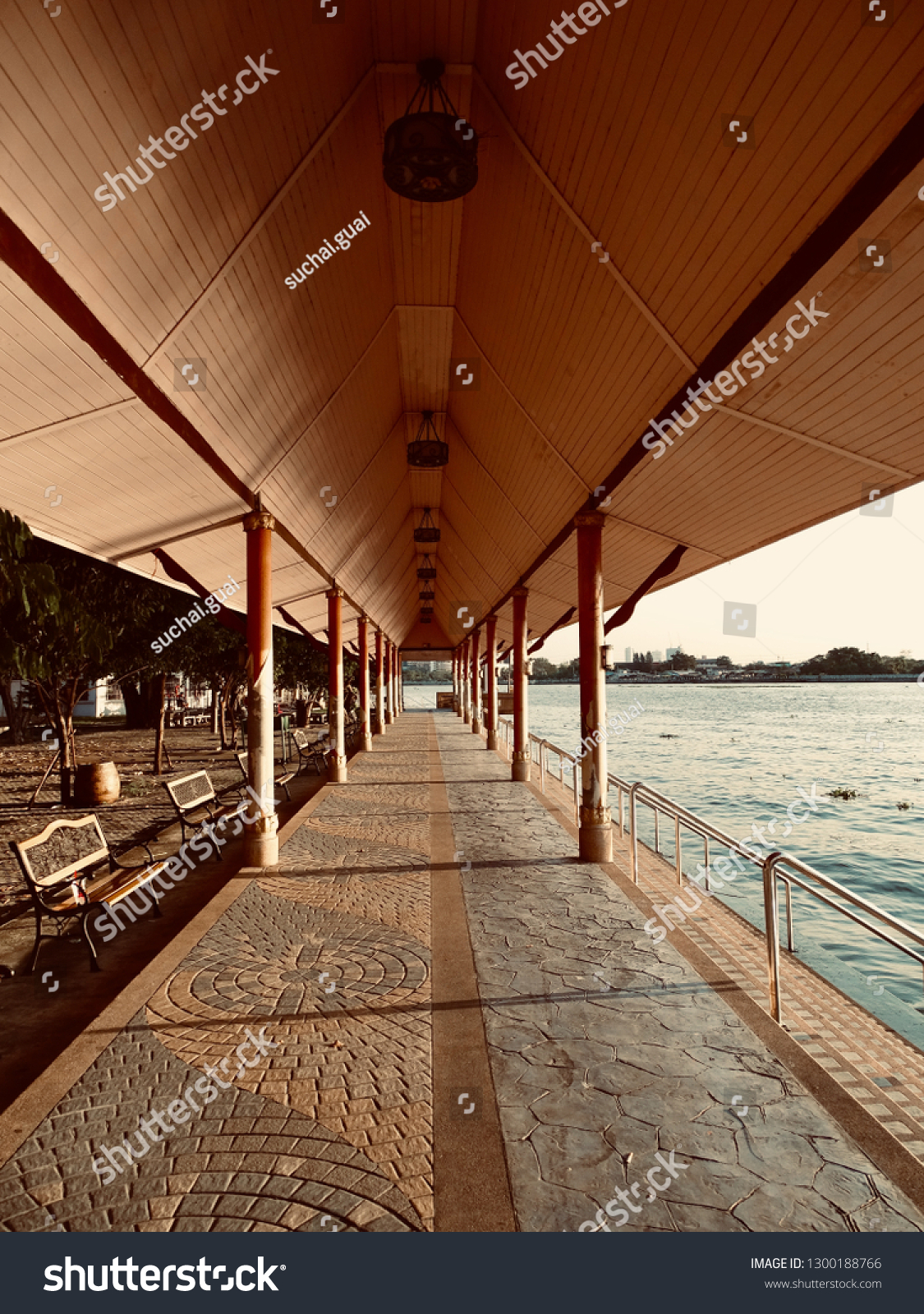 Long Waterfront Pavilion. Waterfront pavilion with waterfront stairs. Temple pavilion at North Bangkok Thailand. -image #1300188766