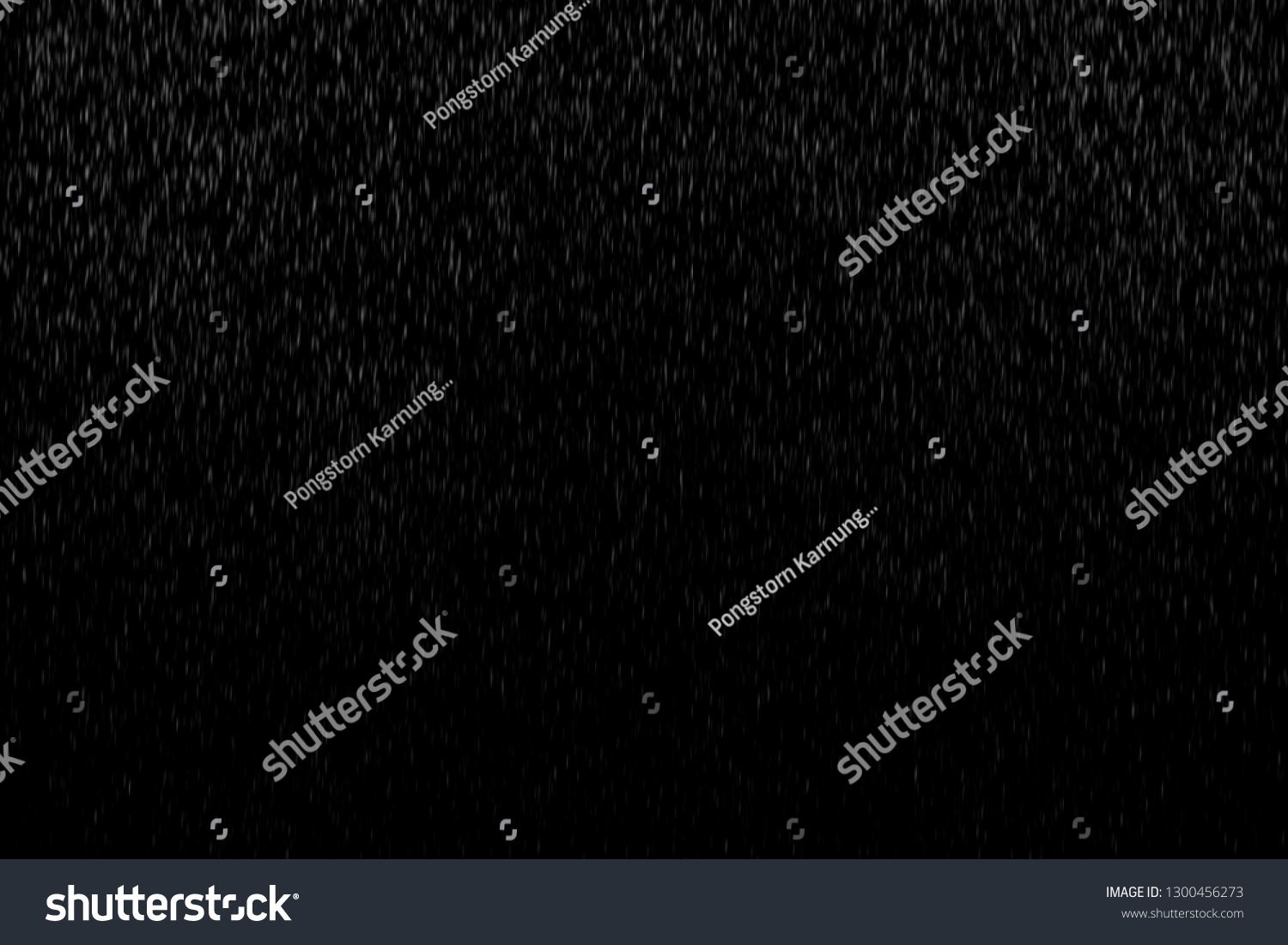 Abstract splashes of Rain and Snow Overlay Freeze motion of white particles on black background #1300456273