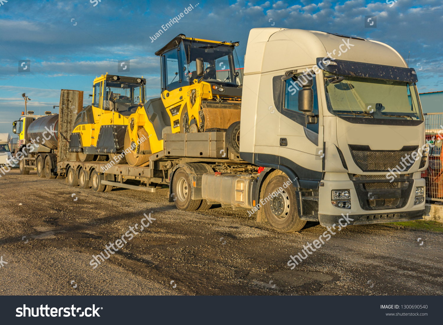 Road transport of heavy machinery in large trucks #1300690540