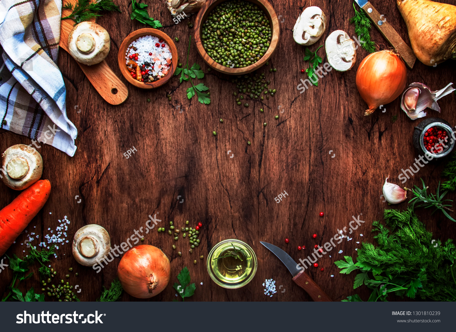Ingredients for cooking green lentils with mushrooms and vegetables, spices and herbs, vintage wooden kitchen table background, place for text. Vegan or vegetarian food, clean food concept.  #1301810239