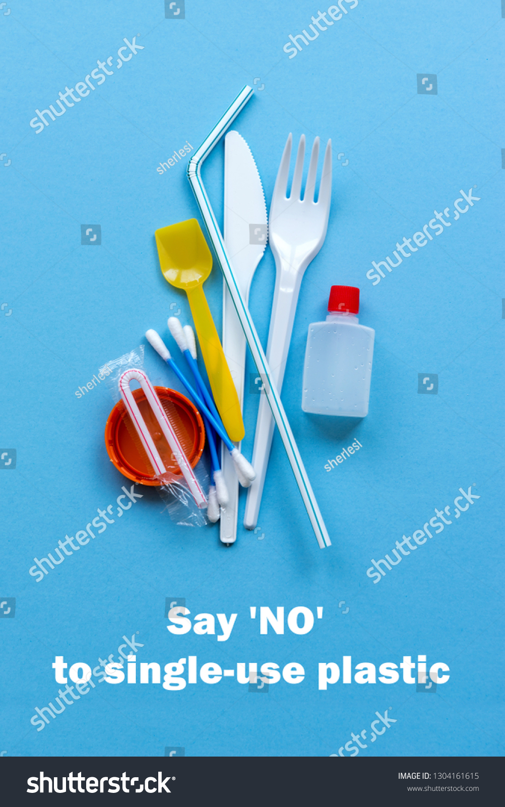 White single-use plastic and plastic drink straws on a blue background. Say no to single use plastic. Environmental, pollution concept. #1304161615