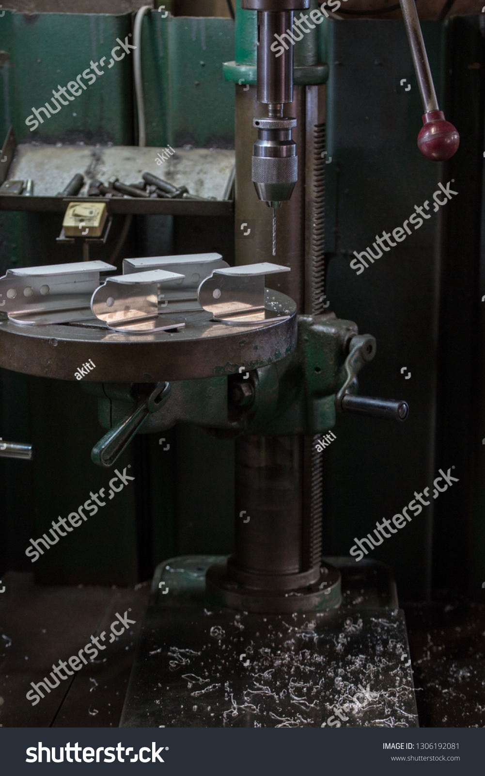 Part machining with drilling machine #1306192081