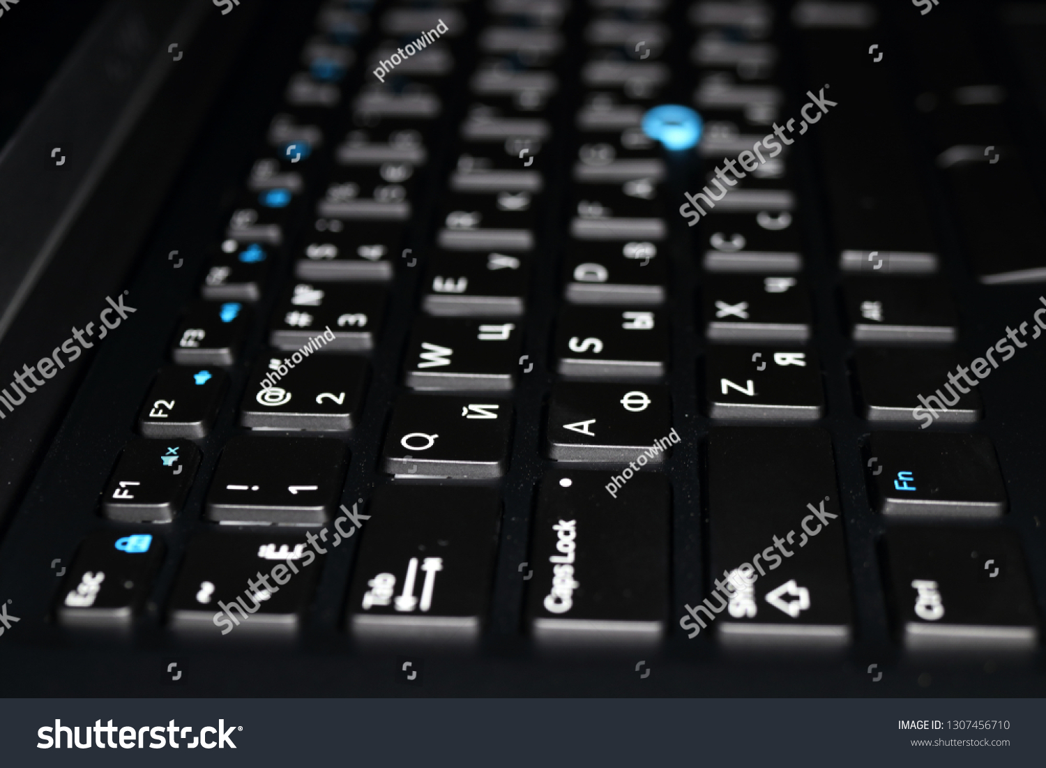 Modern laptop keyboard with a pointing stick #1307456710