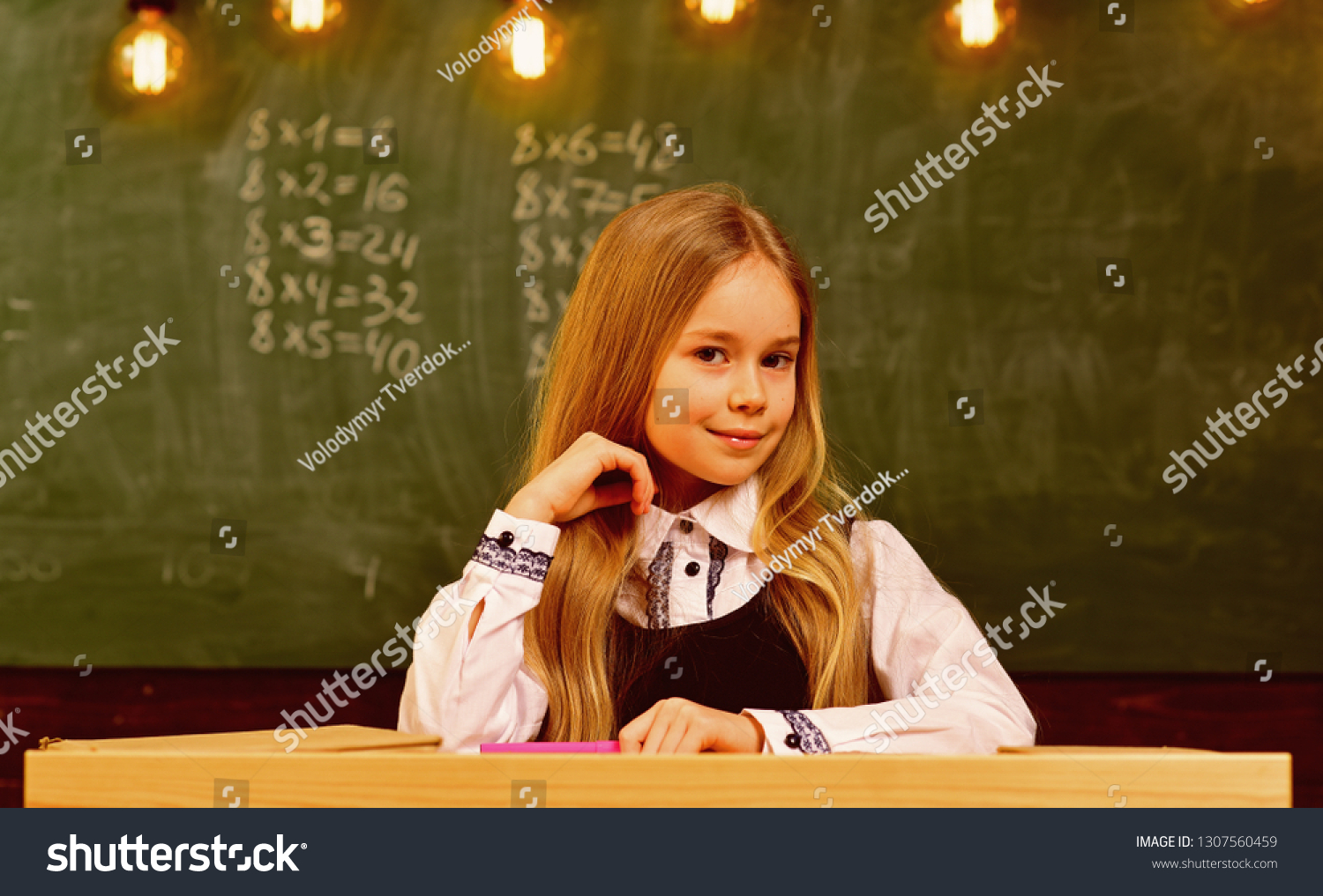 little genius at school. more idea of little genius. future little genius. little genius girl smiling at school. student on exam #1307560459
