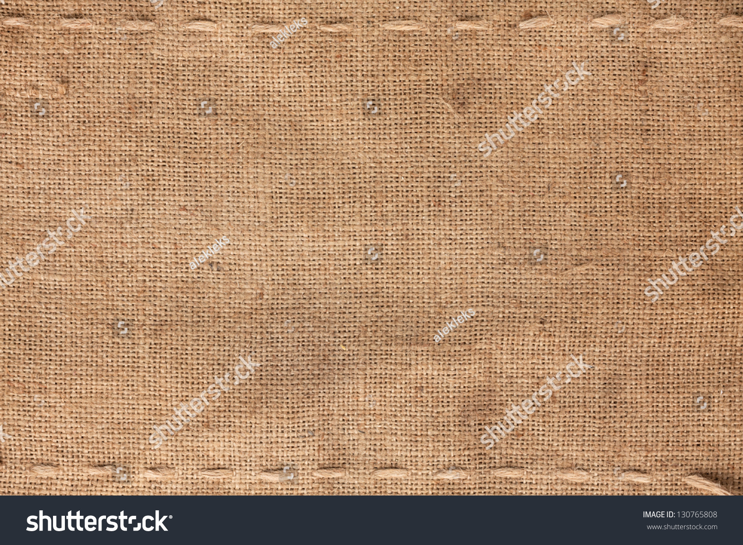 The two horizontal stitching on the burlap as background #130765808