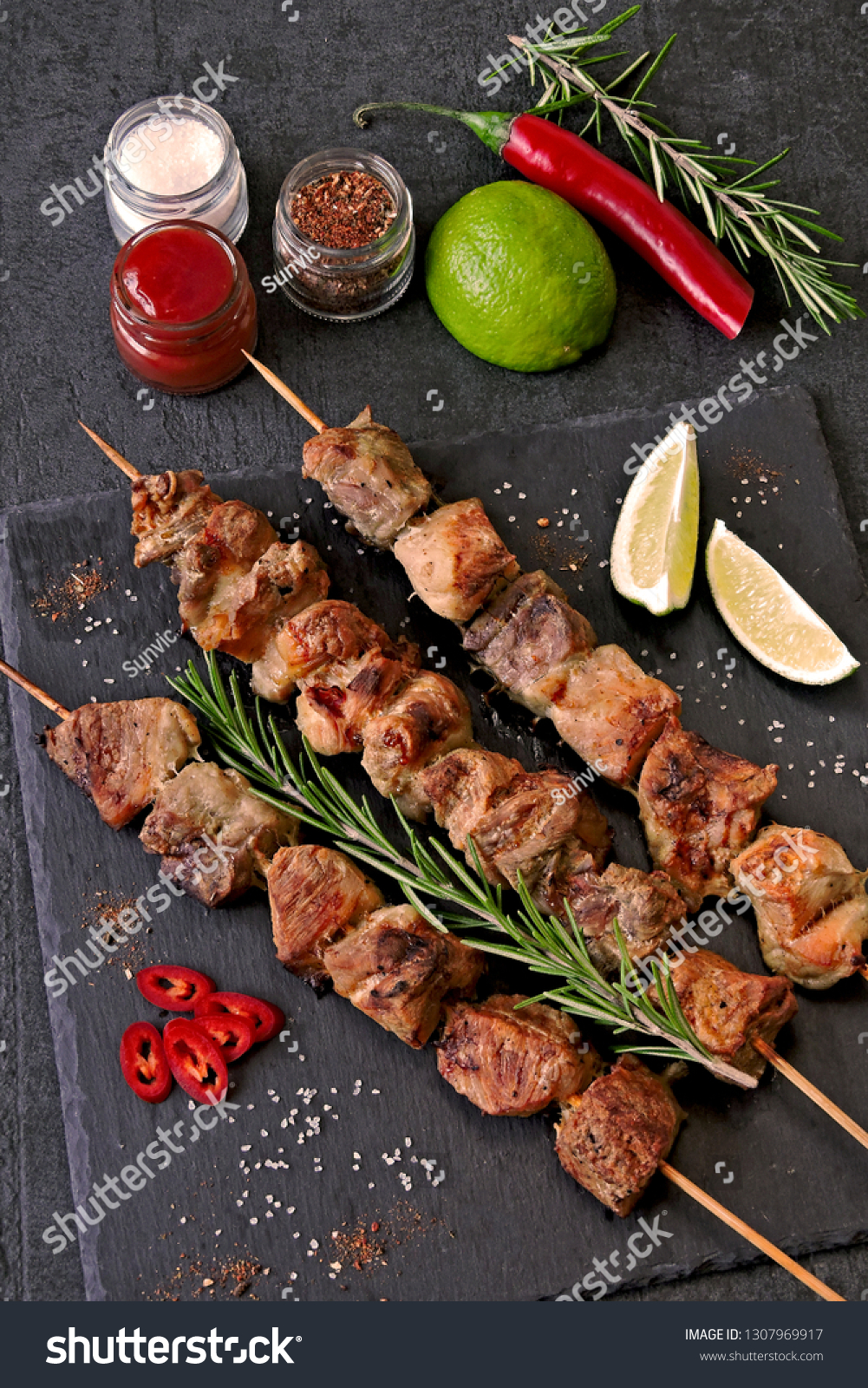 Fresh hot kebab with rosemary, lime and chili. Keto diet. Paleo diet. Pegan diet. #1307969917