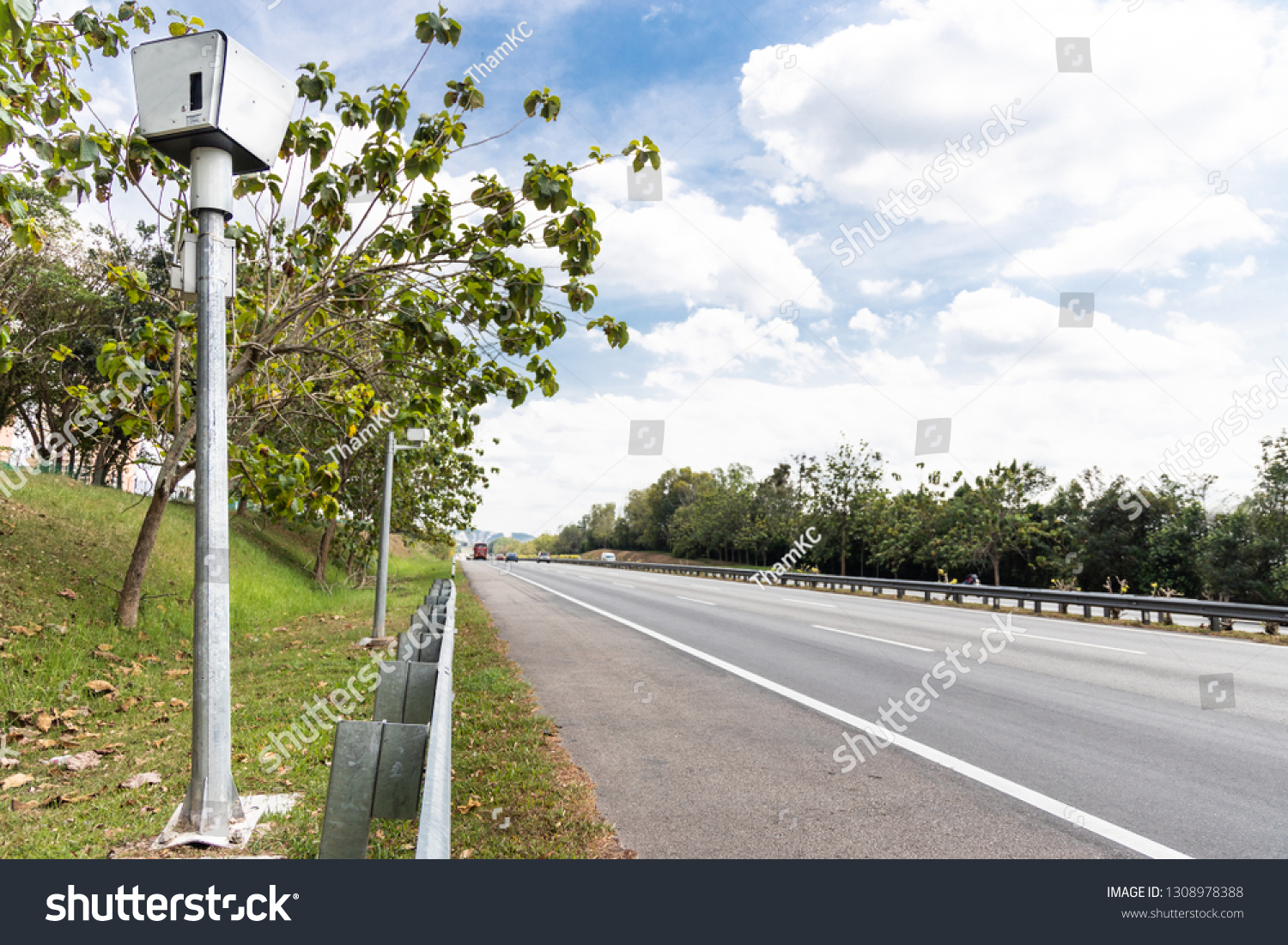 Speed trap surveillance camera along highway to control speeding to reduce speeding related accident #1308978388