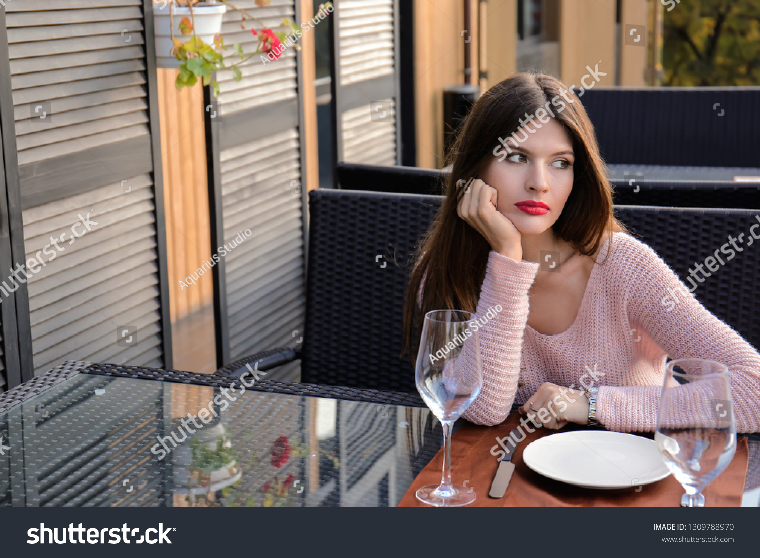 Young woman waiting for her boyfriend in cafe #1309788970