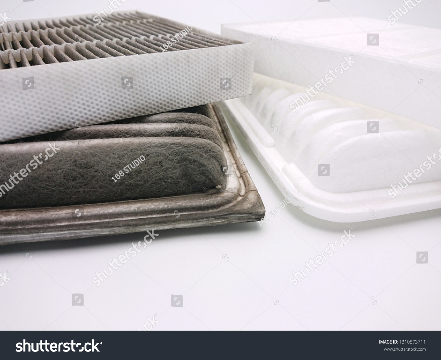Dirty and new automotive cabin, engine air filter isolated on white background #1310573711