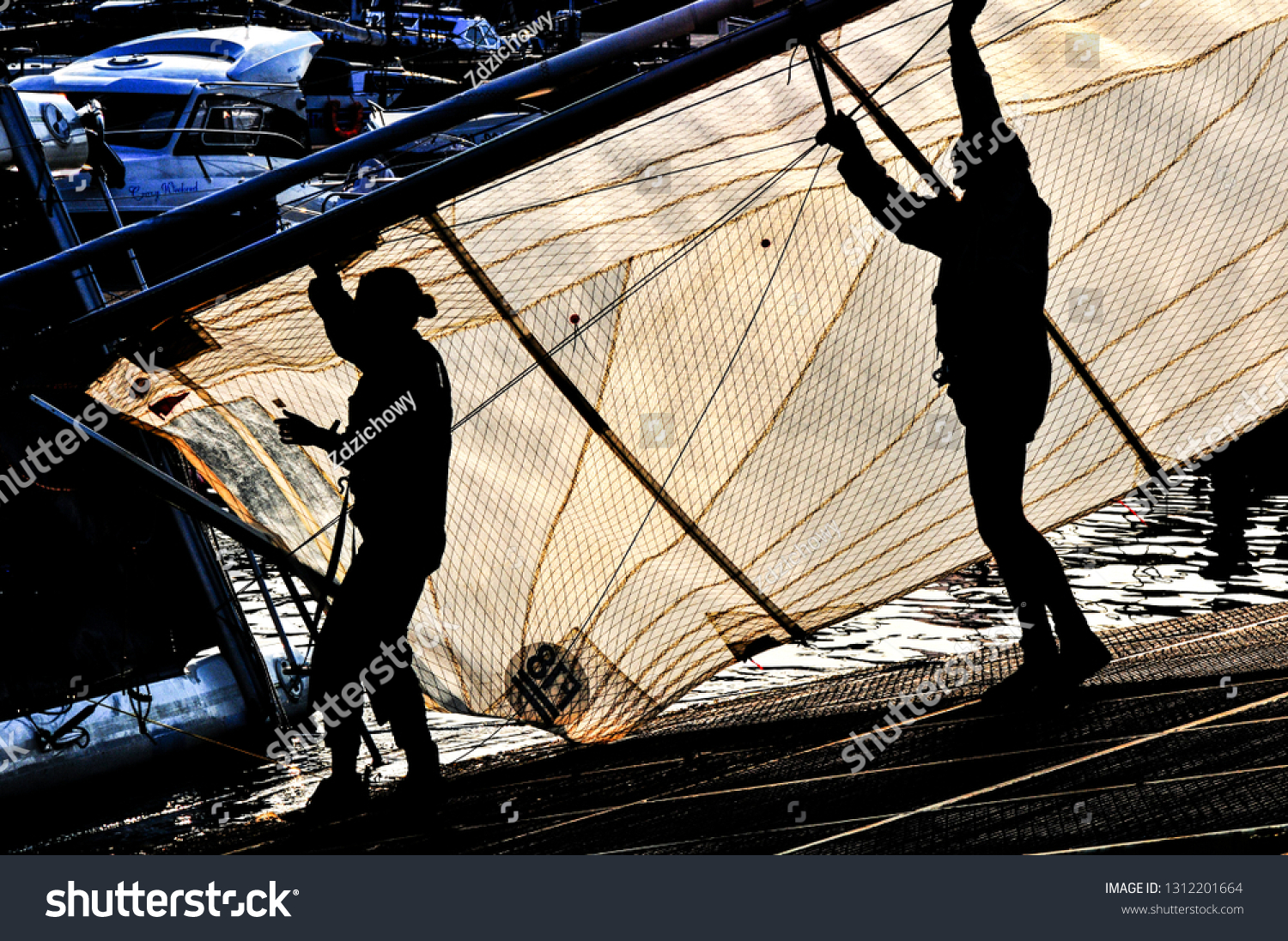 Shadow sailors silhoette picking sail #1312201664