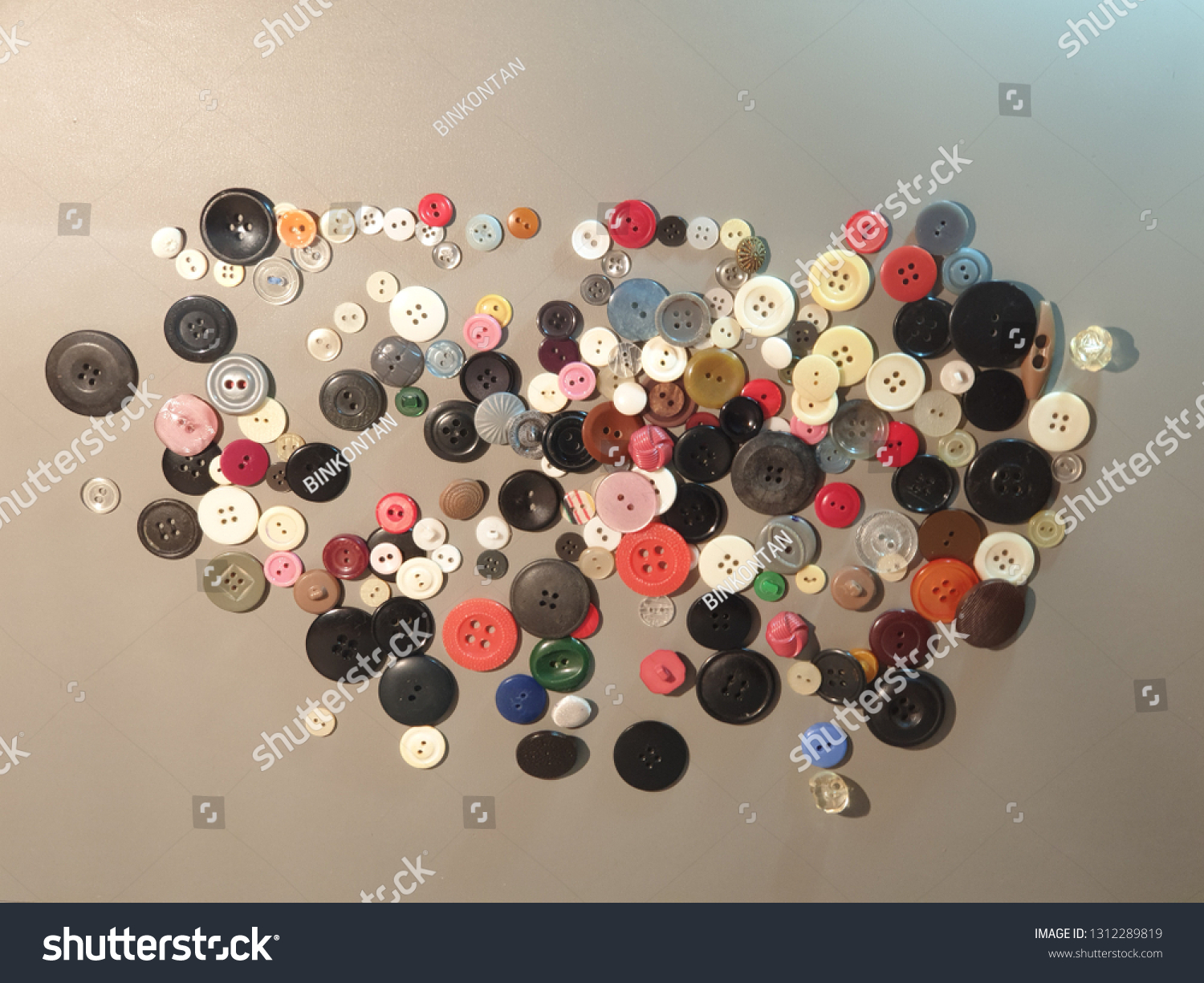 Buttons on clothes close-up. Multicolored buttons. Plastic buttons. #1312289819