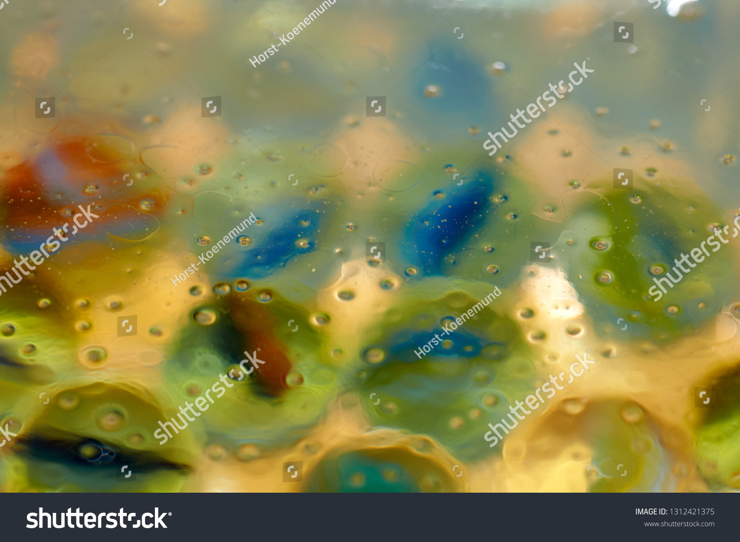 floating in the water abstract colorful, yellow oil drops. #1312421375
