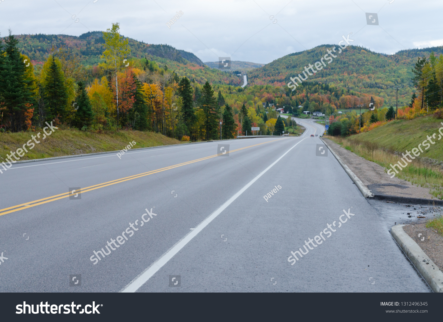 Autumn endless road under cloudscape, Quebec, Canada #1312496345