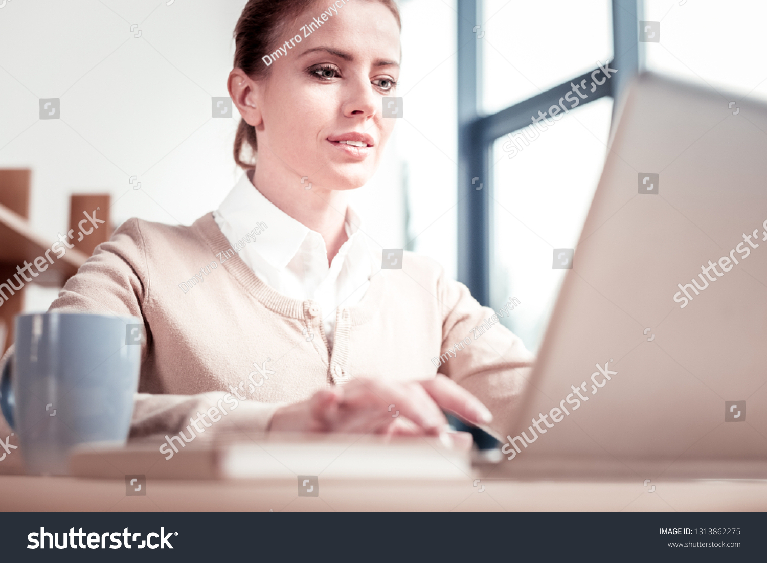 Communication technologies. Communication technologies expert feeling pressed for time using beige laptop while working #1313862275