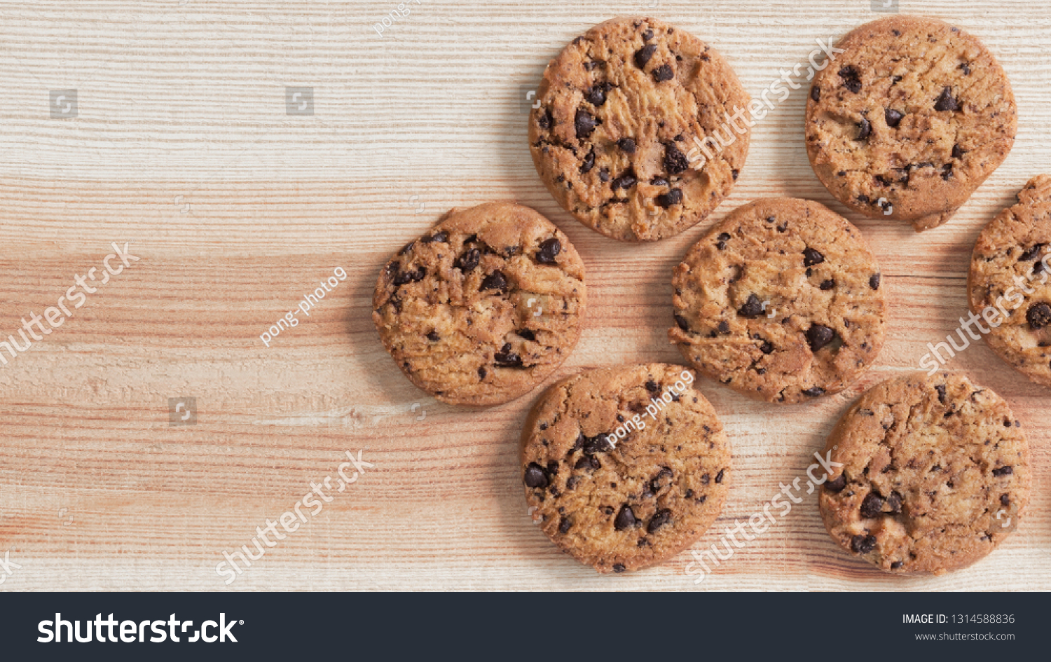 Chocolate chip cookies on the wood table. Copy space for your text or image. #1314588836