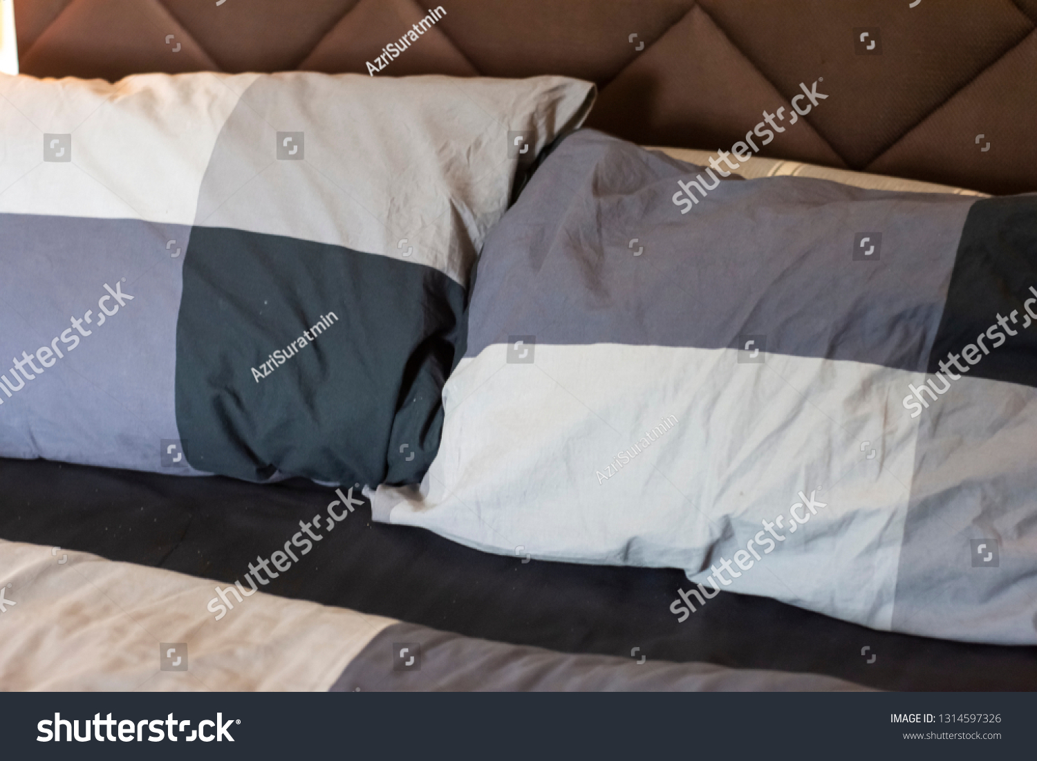 Natural soft pillows on comfortable bed at home #1314597326