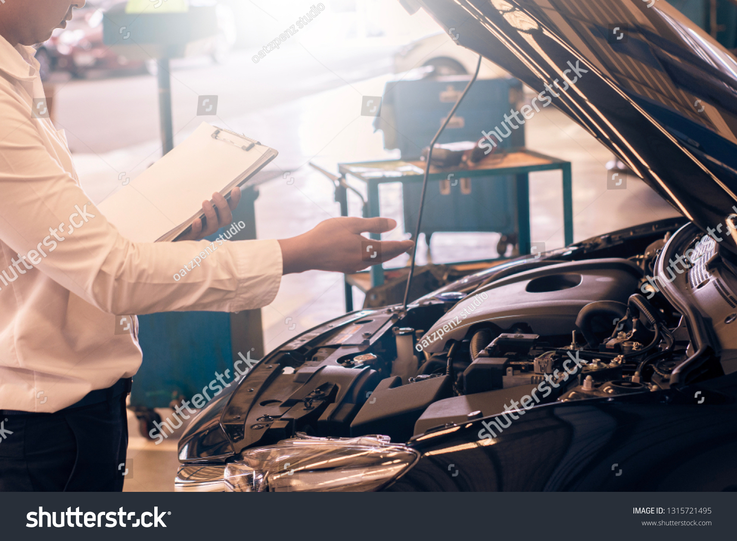 This career man saleman business inspection writing note on notepad or book, paper with car blurry background.for transport automobile automotive Illustrative editorial image #1315721495