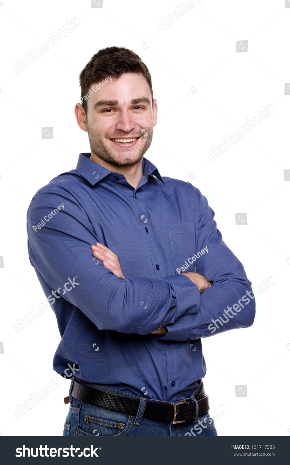 Handsome man wearing a blue shirt and jeans isolated on a white background #131717585