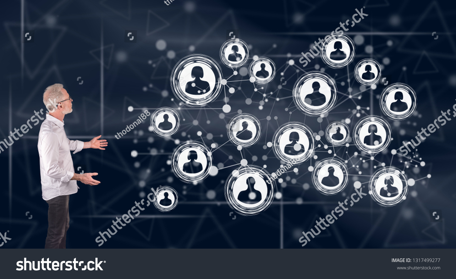 Businessman showing a social network concept on a wall screen #1317499277