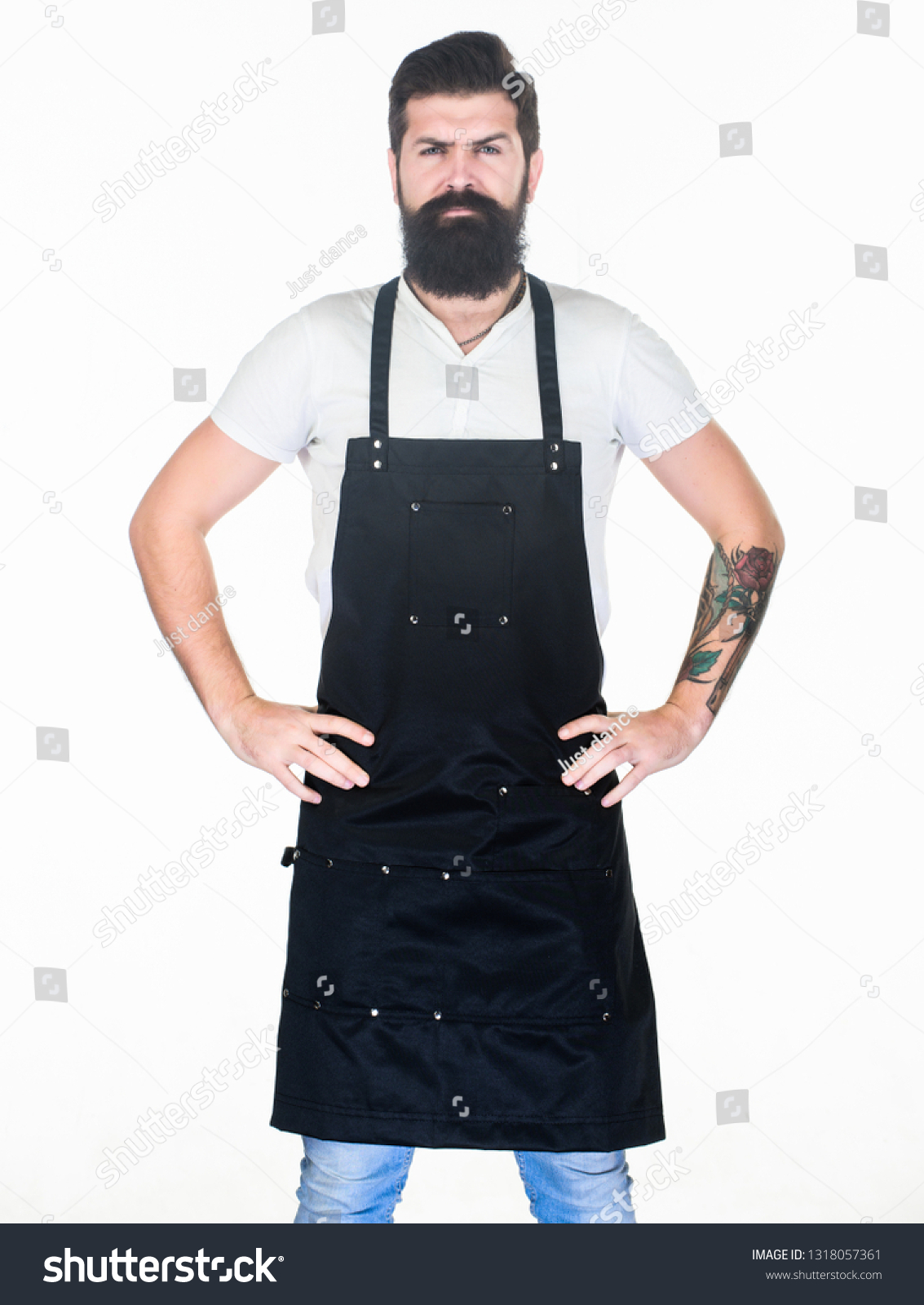 Man cook brutal hipster. Fast food restaurant. Serious bearded cook. Restaurant staff. Hipster professional barista apron uniform. Waiter or bartender. Ready serve drink. Bearded hipster wear apron. #1318057361