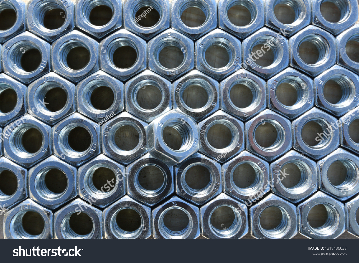 Many metal nuts. Abstract industry background. Natural photo. #1318436033