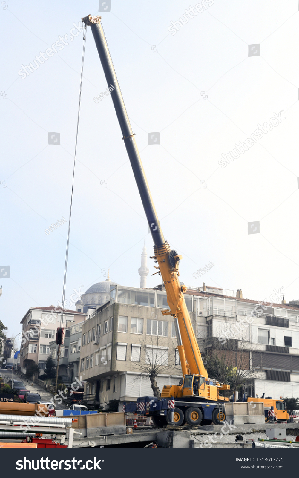 Turkey, istanbul, February 20, 2019: Mobile crane with its boom risen outdoors #1318617275