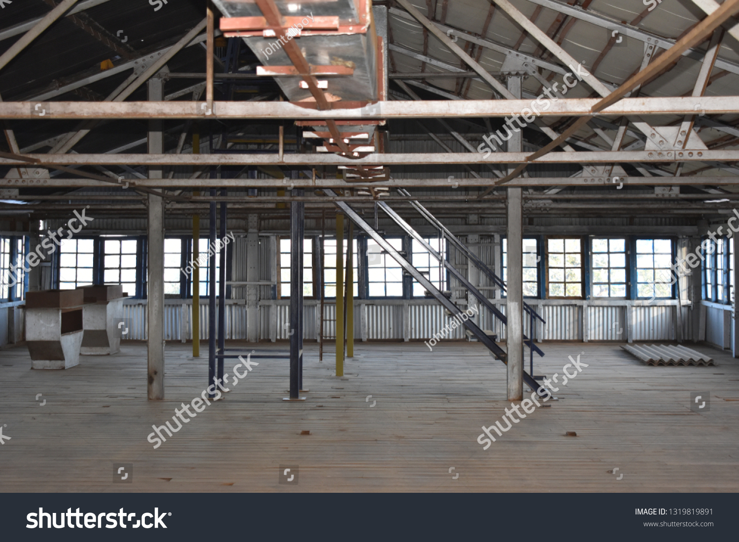 Old Factory Godown made of wood and steel with staircase and rooftop  #1319819891
