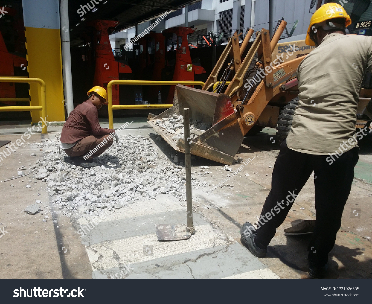 KUALA LUMPUR, MALAYSIA FEBRUARY, 23 2019 : Breaking work and cleaning concrete floors using heavy machinery #1321026605