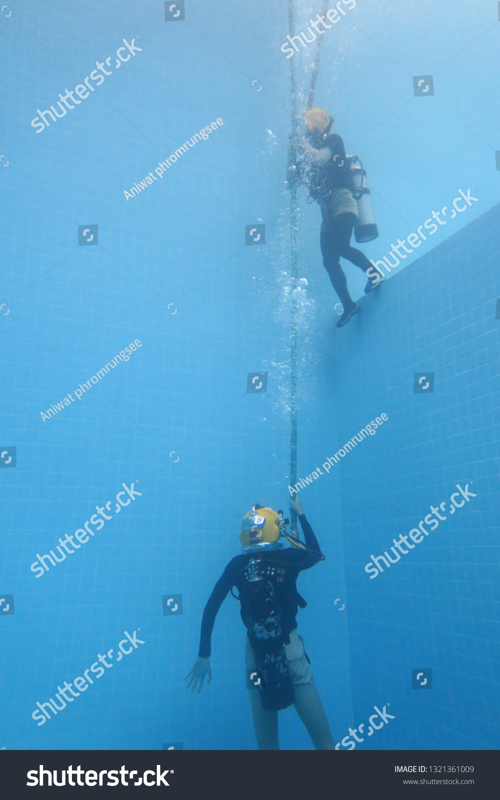 surface supplied commercial diver.
diver.
Underwater. #1321361009