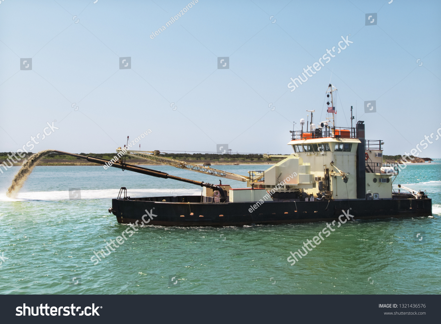 Dredge boat removing sand and silt from the bottom. Dredger ship works.Pumping sand. #1321436576