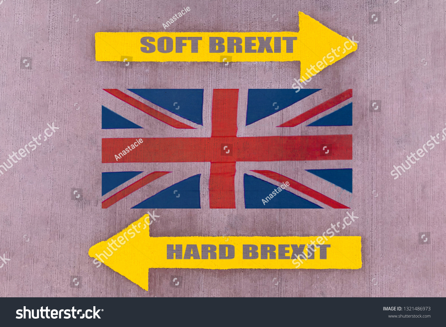 Two yellow arrow pointers showing the opposite direction, the inscriptions "SOFT BREXIT" and "HARD BREXIT" on a rubber pavement, Union Jack flag between them (concept) #1321486973