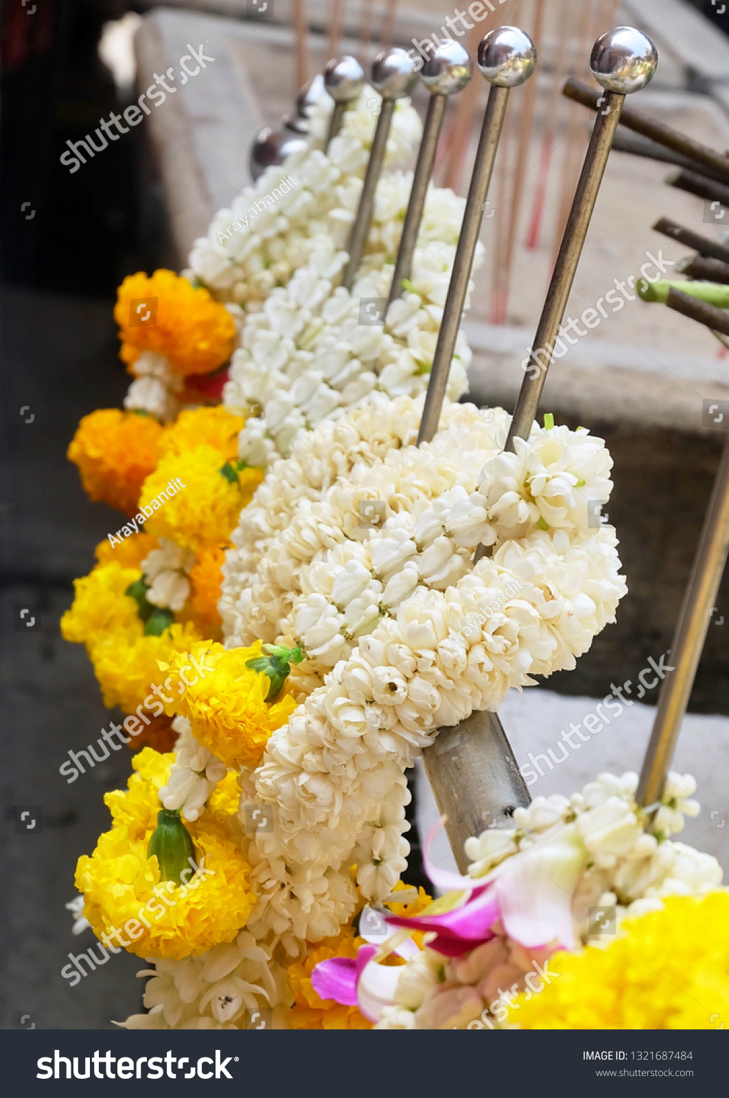 Beautiful Jasmine Wreaths or Garlands with Yellow Marigold Flowers, The Garland in Thai Tradition Style Used to Pay Respect to The Buddha. #1321687484