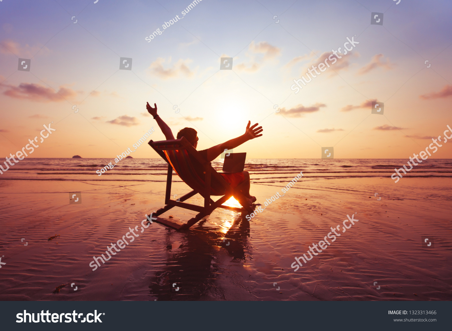 happy freelancer with laptop computer working on the beach, freelance work concept, dream office job workplace #1323313466