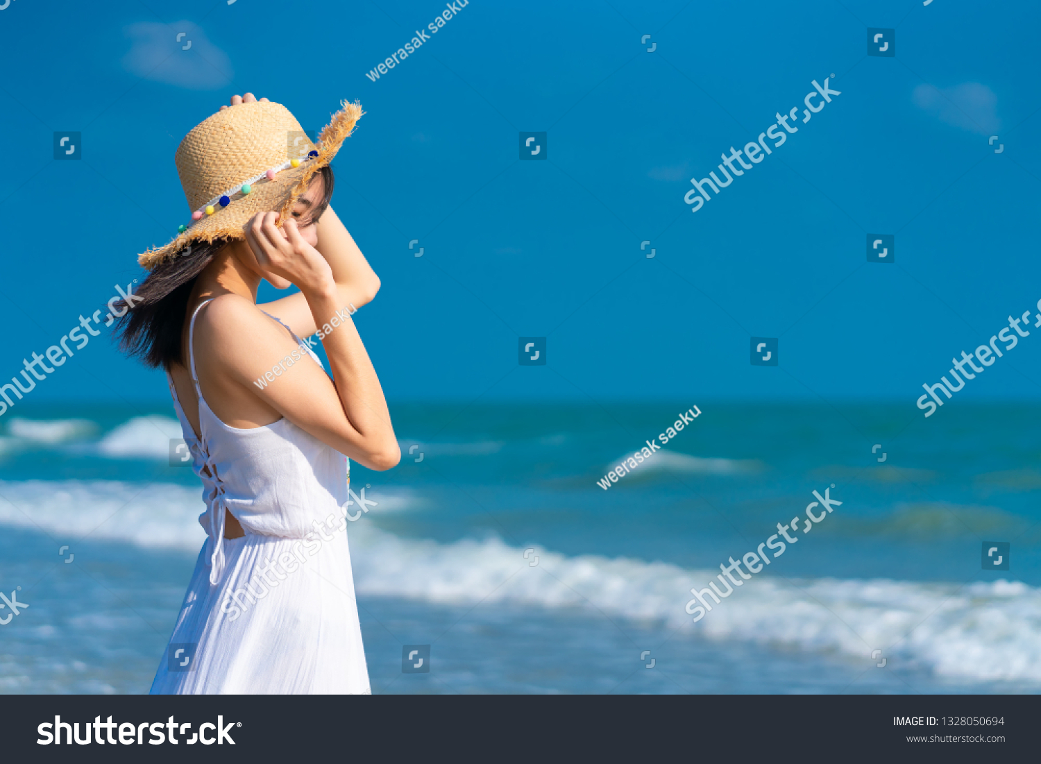 Woman relaxing on the beach. Woman relaxing on the beach. .Vacation lifestyle. #1328050694