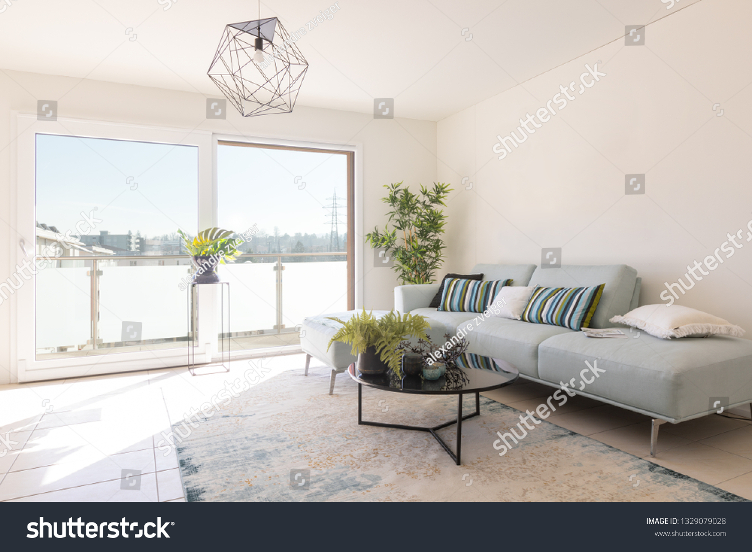 Modern living room with designer sofa and coffee table. Window with view. Nobody inside #1329079028