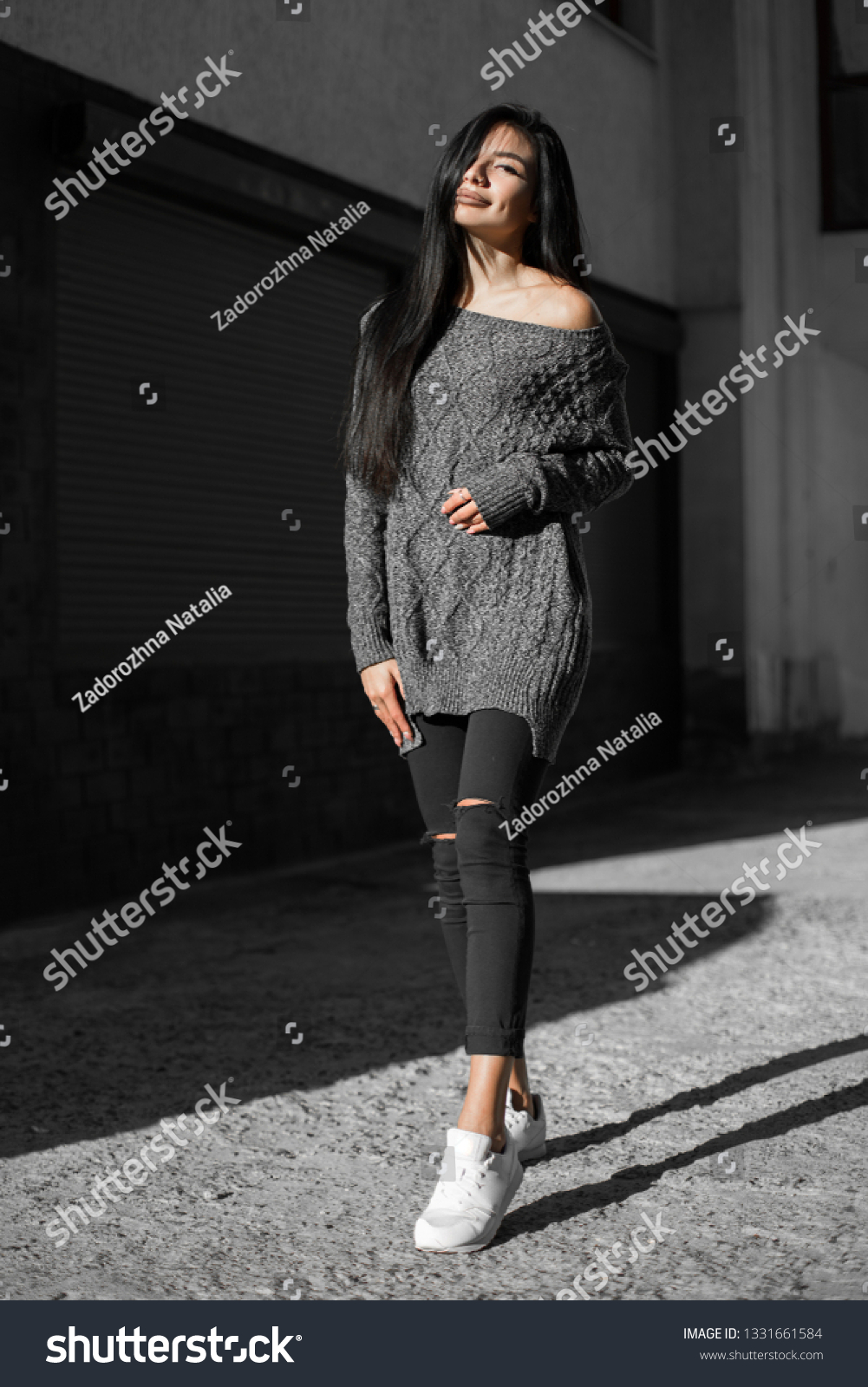 Beautiful model poses for the camera on the streets. #1331661584