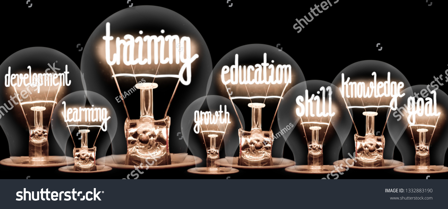 Photo of light bulbs with shining fibers in a shape of TRAINING and EDUCATION concept related words isolated on black background #1332883190