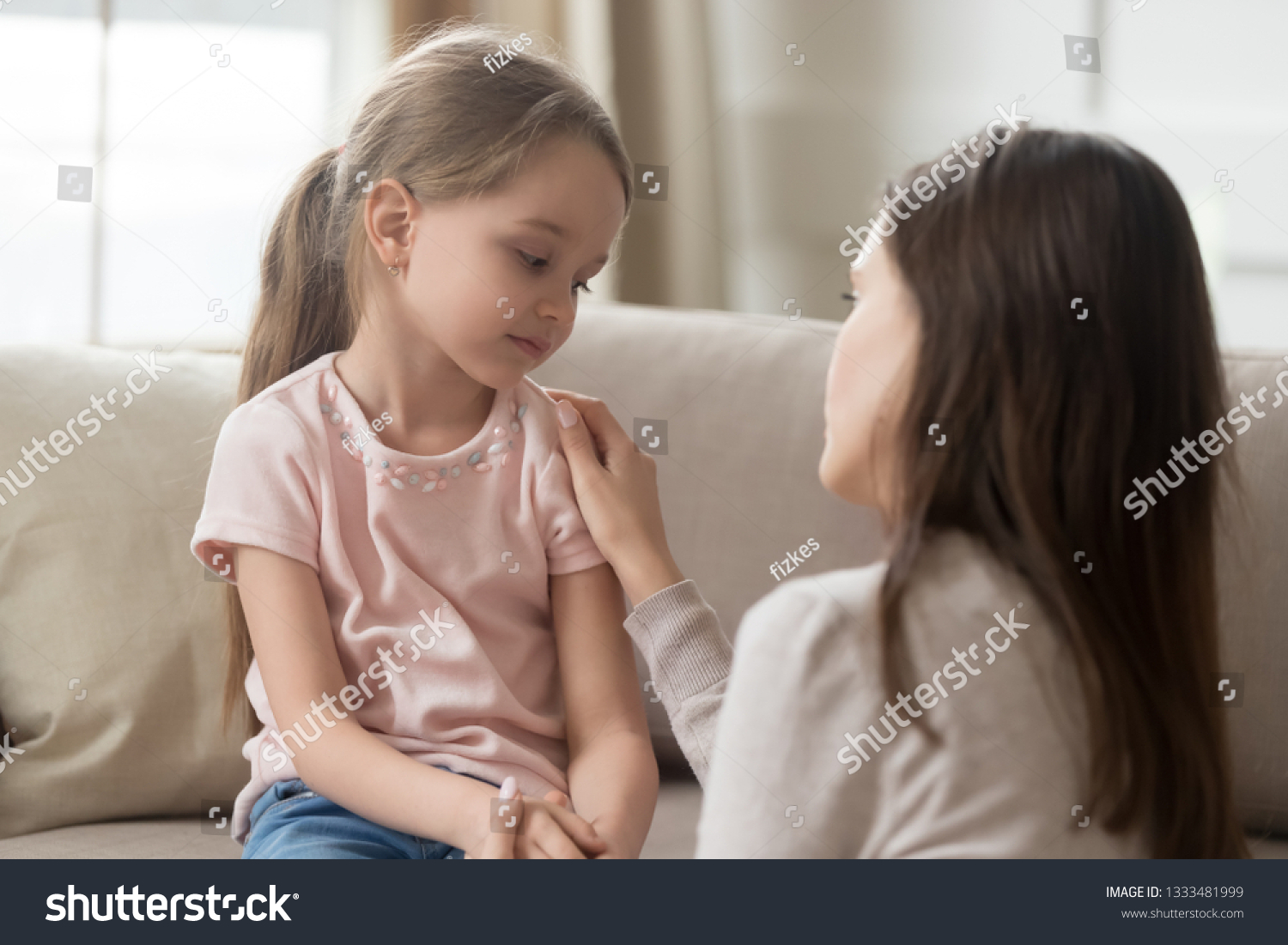Loving worried mom psychologist consoling counseling talking to upset little child girl showing care give love support, single parent mother comforting sad small sullen kid daughter feeling offended #1333481999