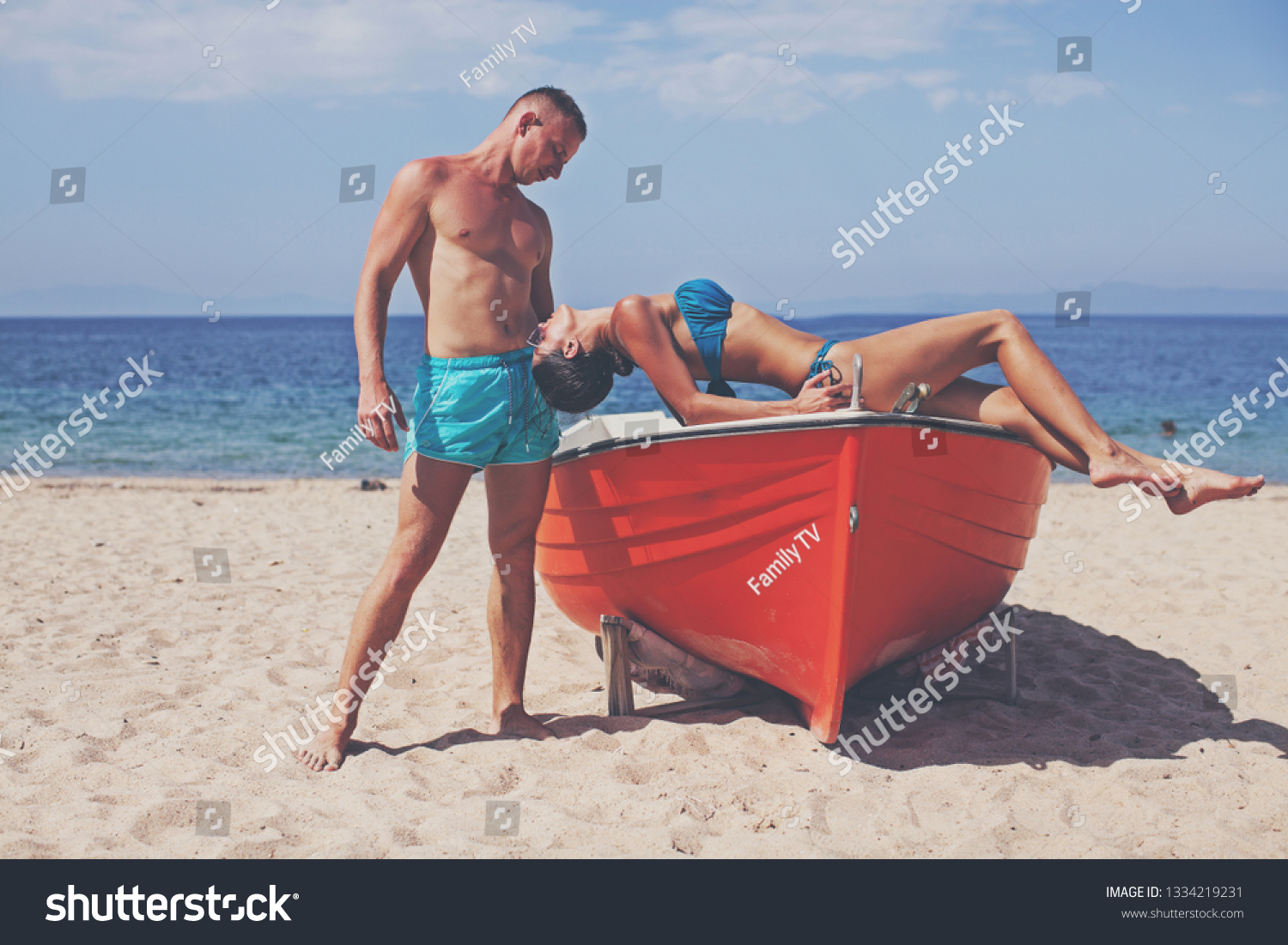 Sea couple. Couple in love. Adult. Old boat. Travel. Vacation. Travel concept. Sexy girl. Sensual. Romance lovers. Sea background. Life. Dream.  #1334219231