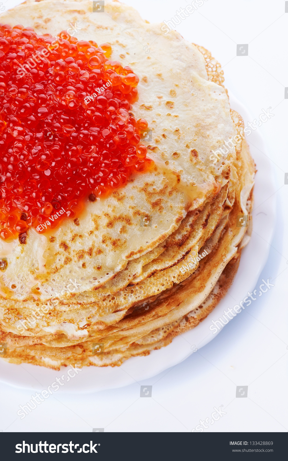 Pancakes with red caviar. Pile of pancakes. Pancakes on a plate. Red caviar. #133428869