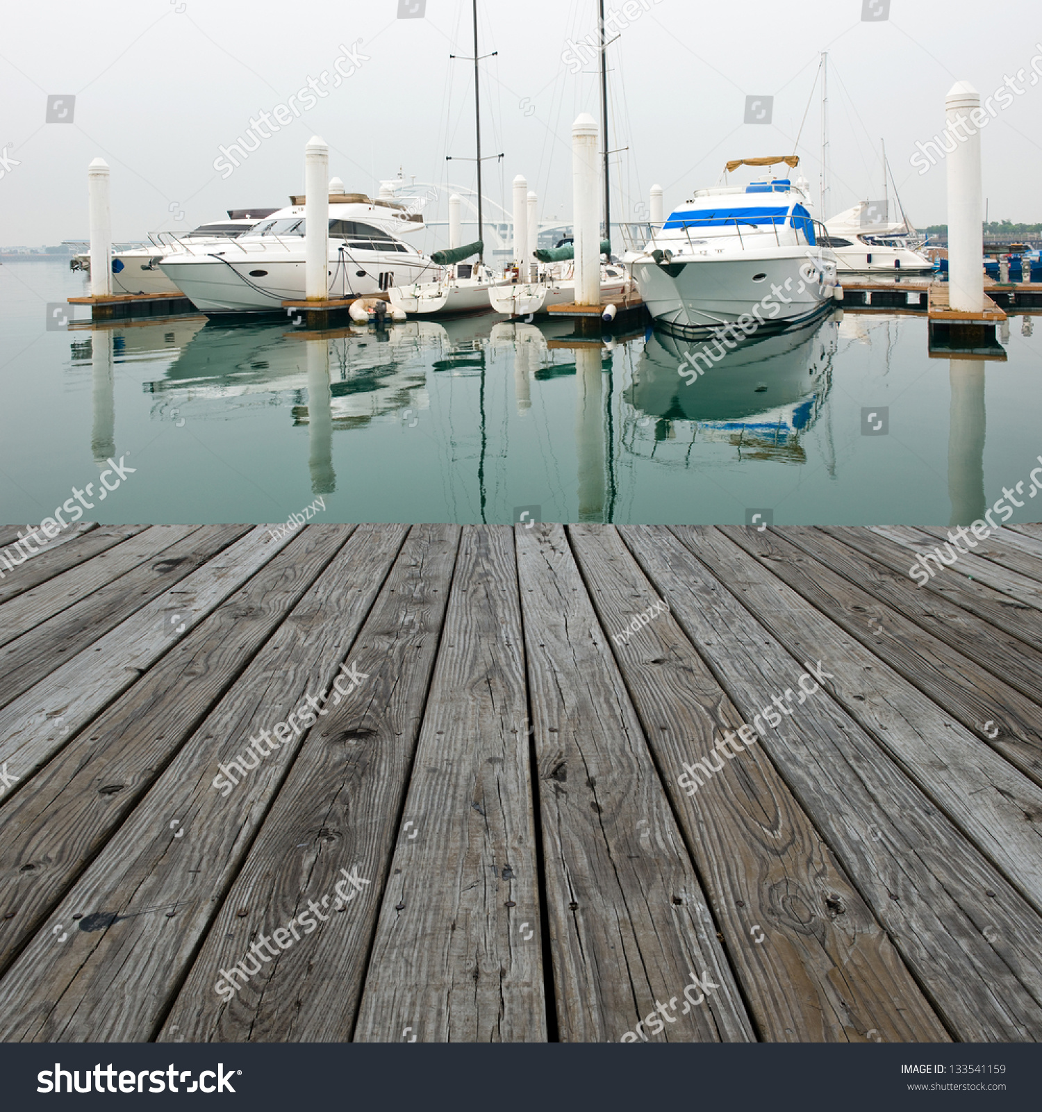 Wood platform beside yachts at marina. #133541159