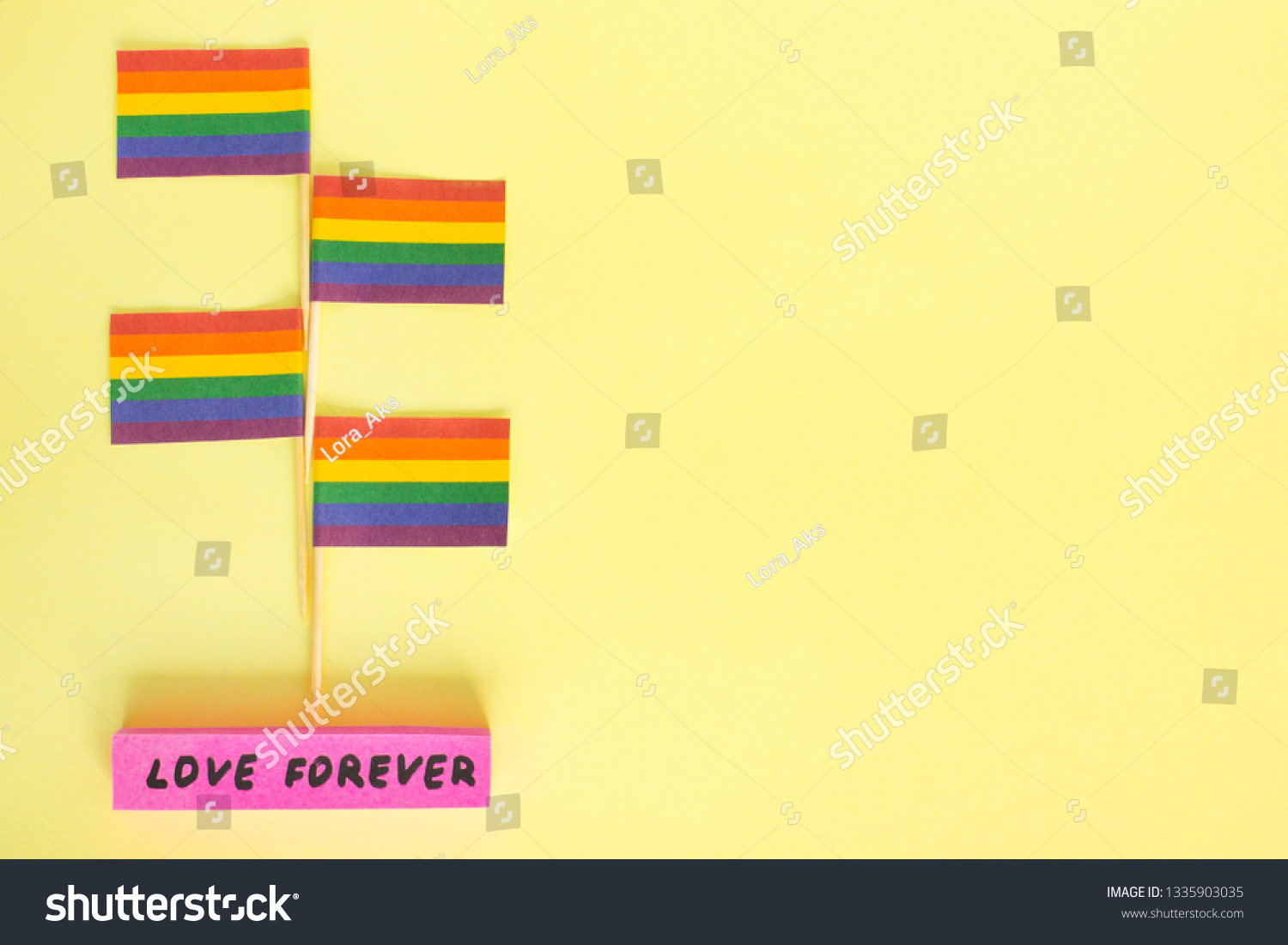 LGBT, LGBTQ, symbols on rainbow flags, four checkboxes with the symbolism, stand with the inscription: love forever. Rights of homosexual people, gays, lesbians, bisexual, transgender. Copy space, #1335903035