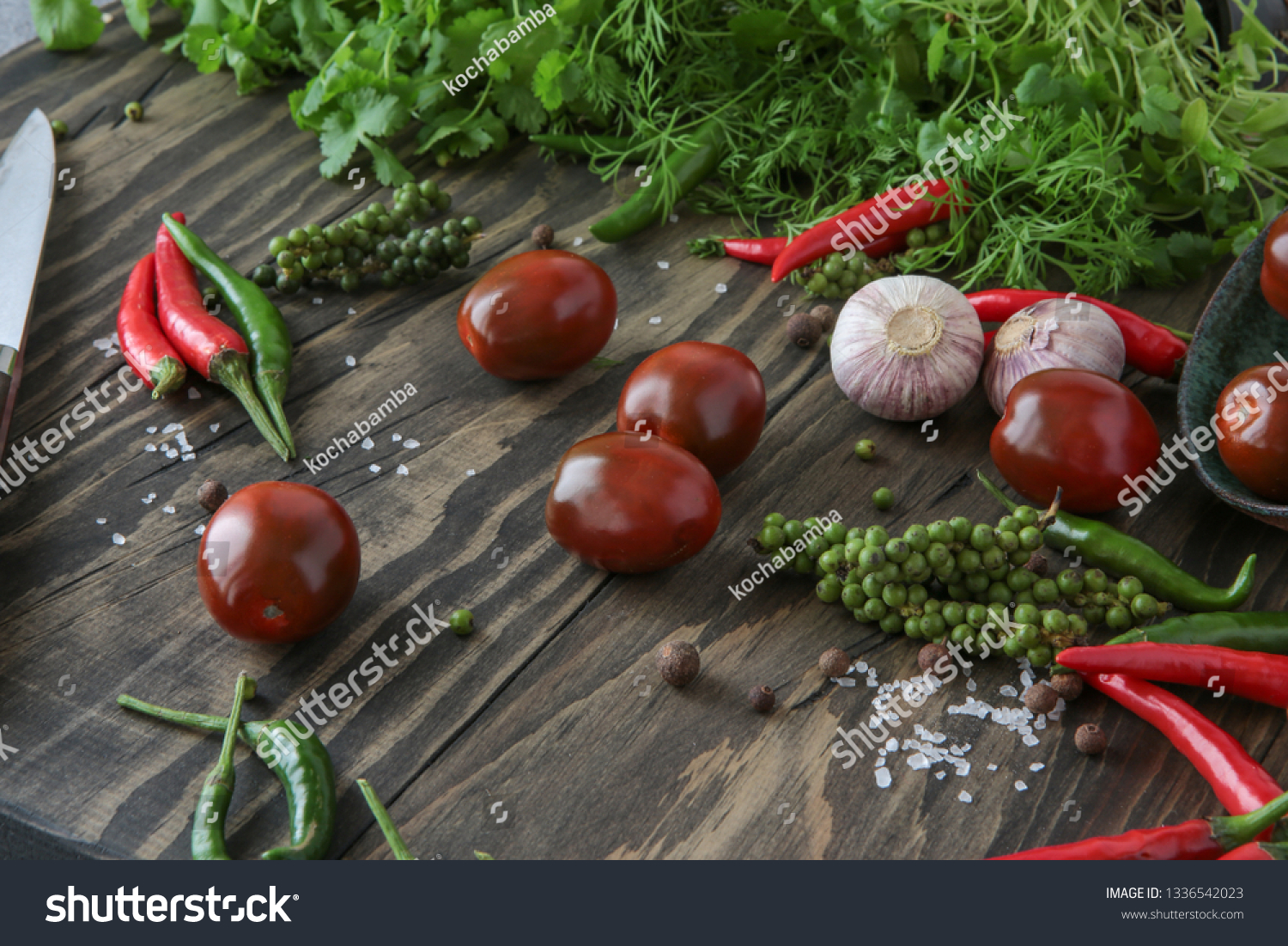 chili, allspice, garlic, parsley, coriander, dill, tomatoes on the table #1336542023