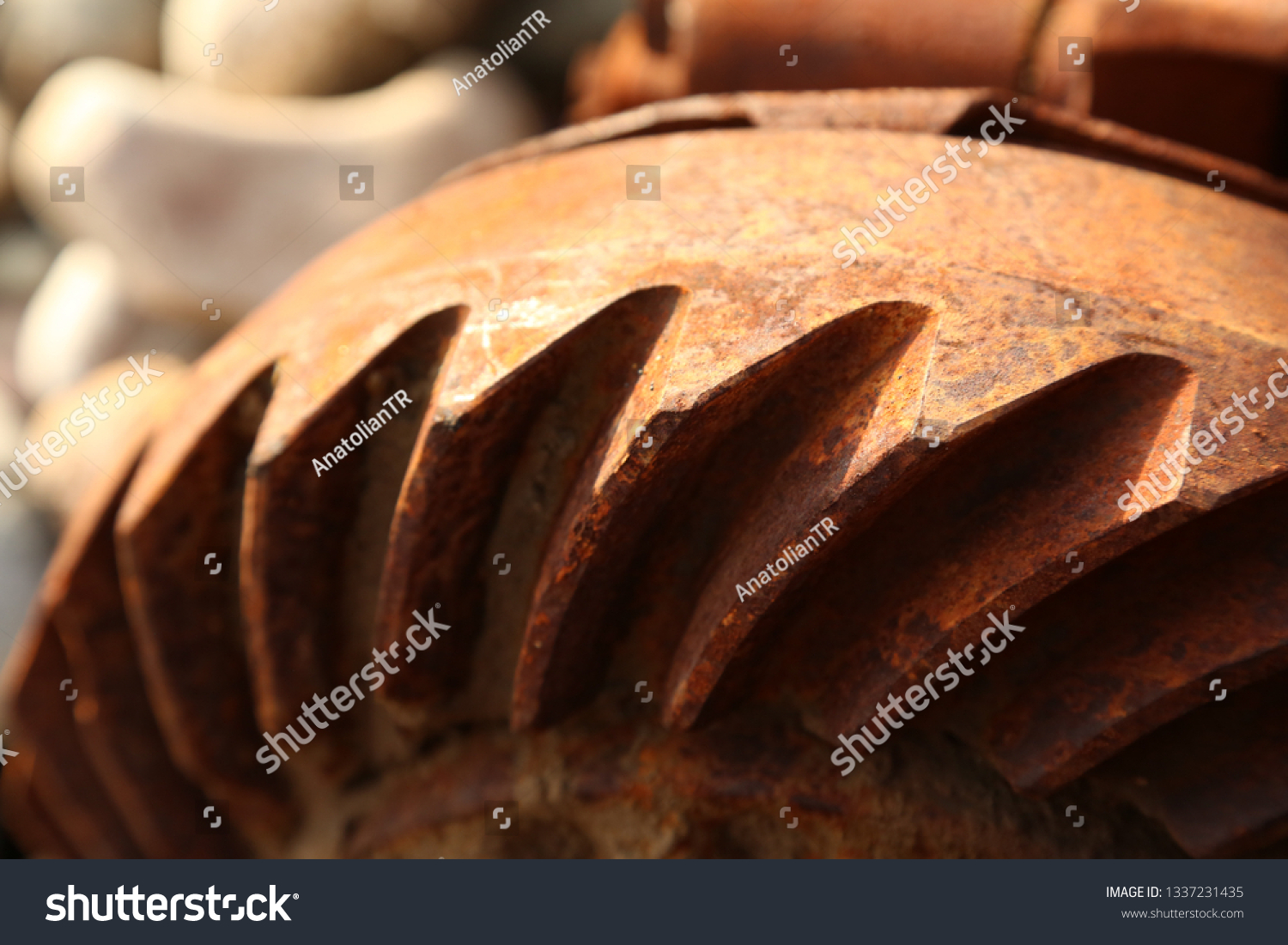closeup rusty wheel, rusty flywheel, rusty rotor, rusty cogwheel #1337231435