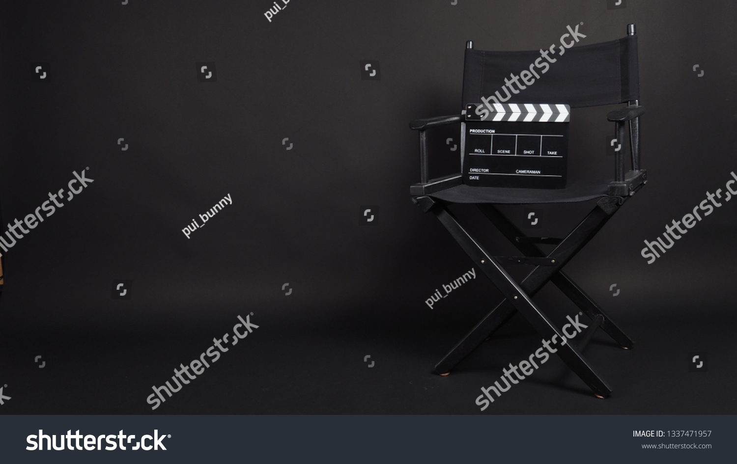 Clapper board or movie slate with director chair use in video production or movie and cinema industry. It's black color. #1337471957