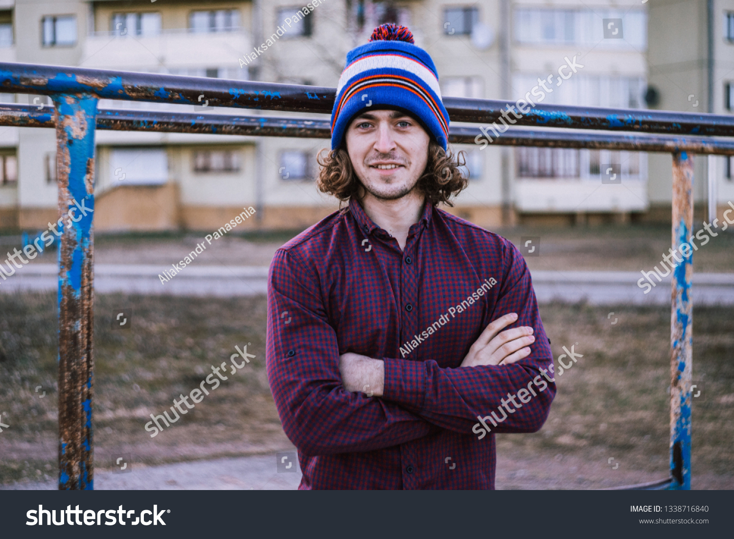 
Curly guy. Curly guy on the sports field. 
Curly guy on the playground. Curly guy in a hat #1338716840