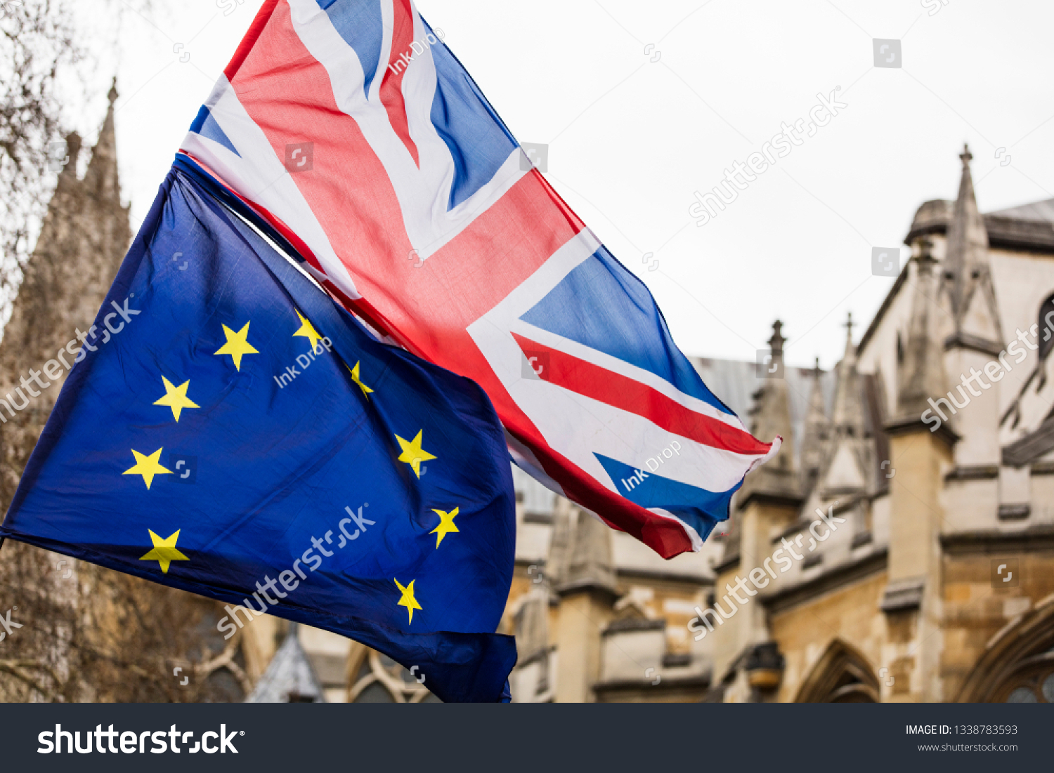 European Union and British Union Jack flag flying together.  #1338783593