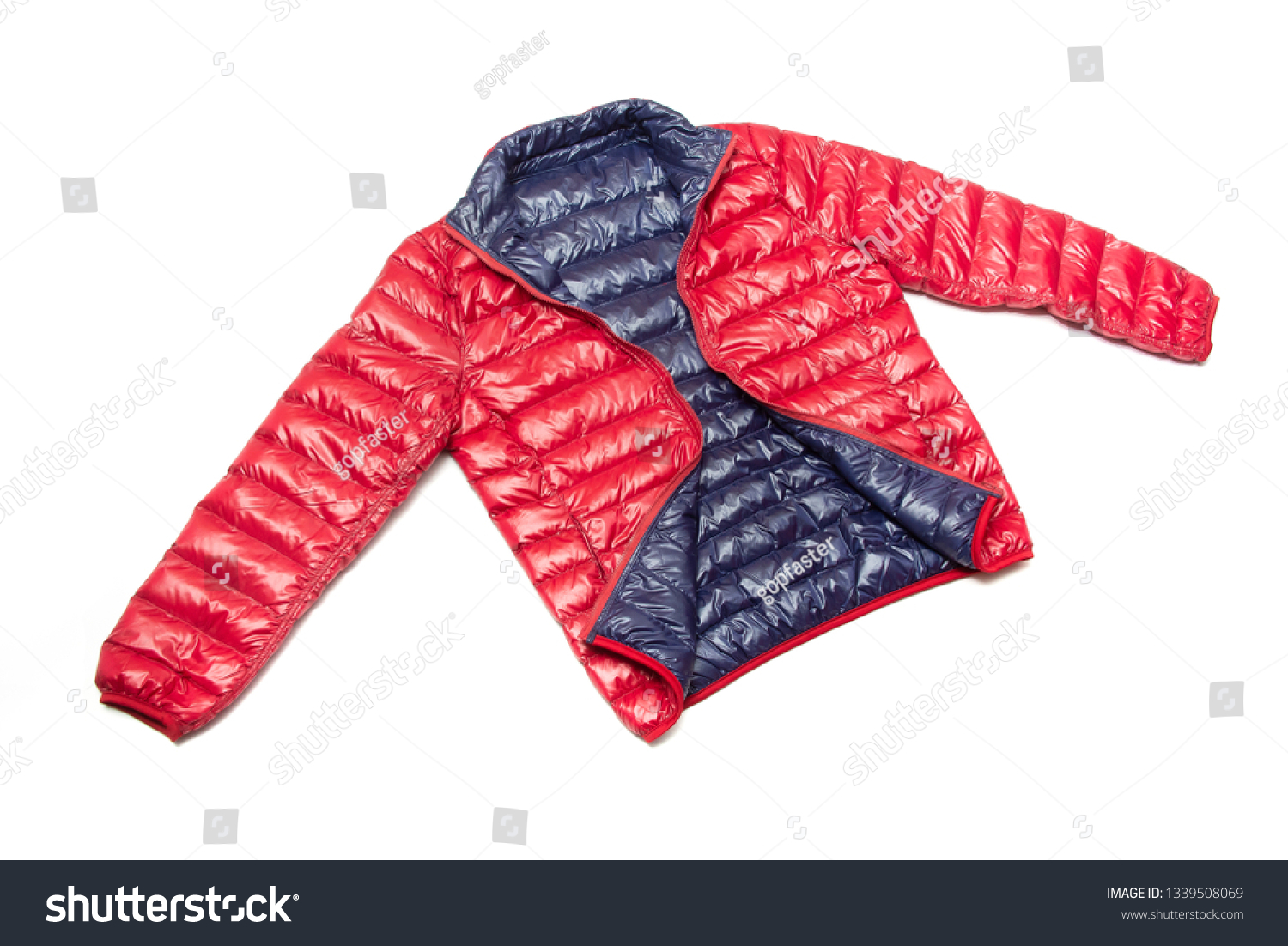 ฺBlue and red full zipper windbreaker down jacket, rain proof down jacket. Down jacket sport shiny nylon full zip isolated on white. #1339508069