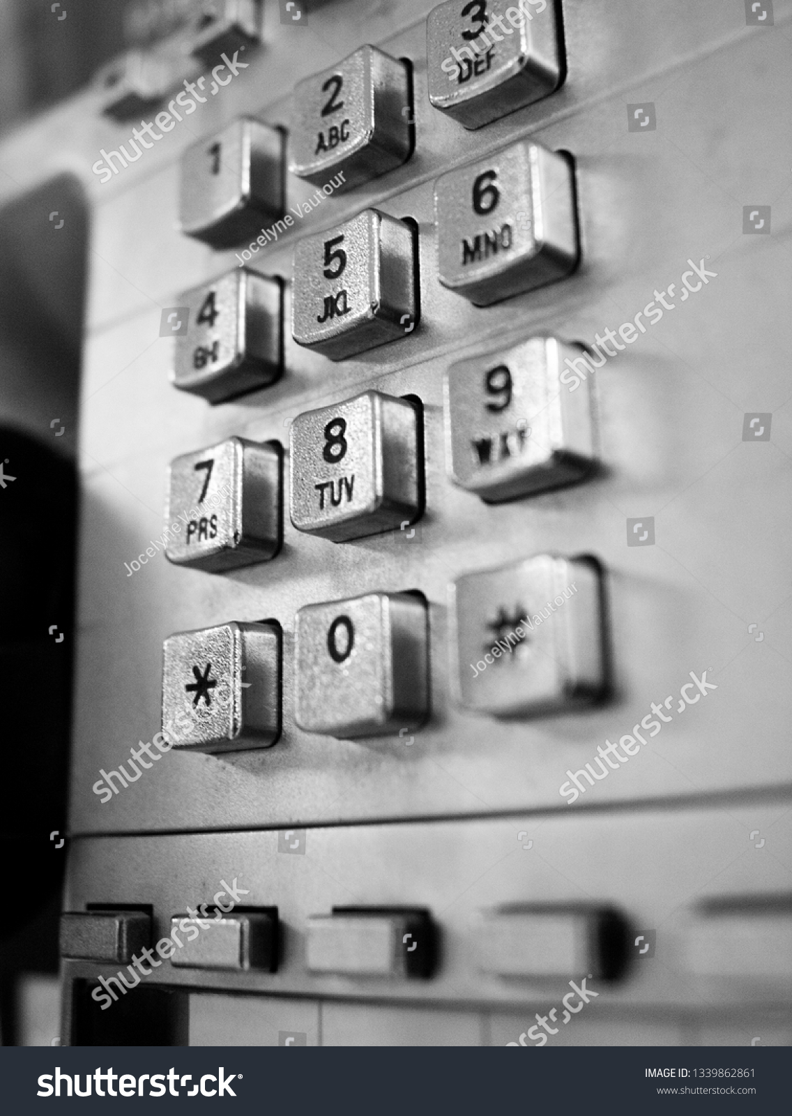 Telephone from a telephone booth in black and white #1339862861