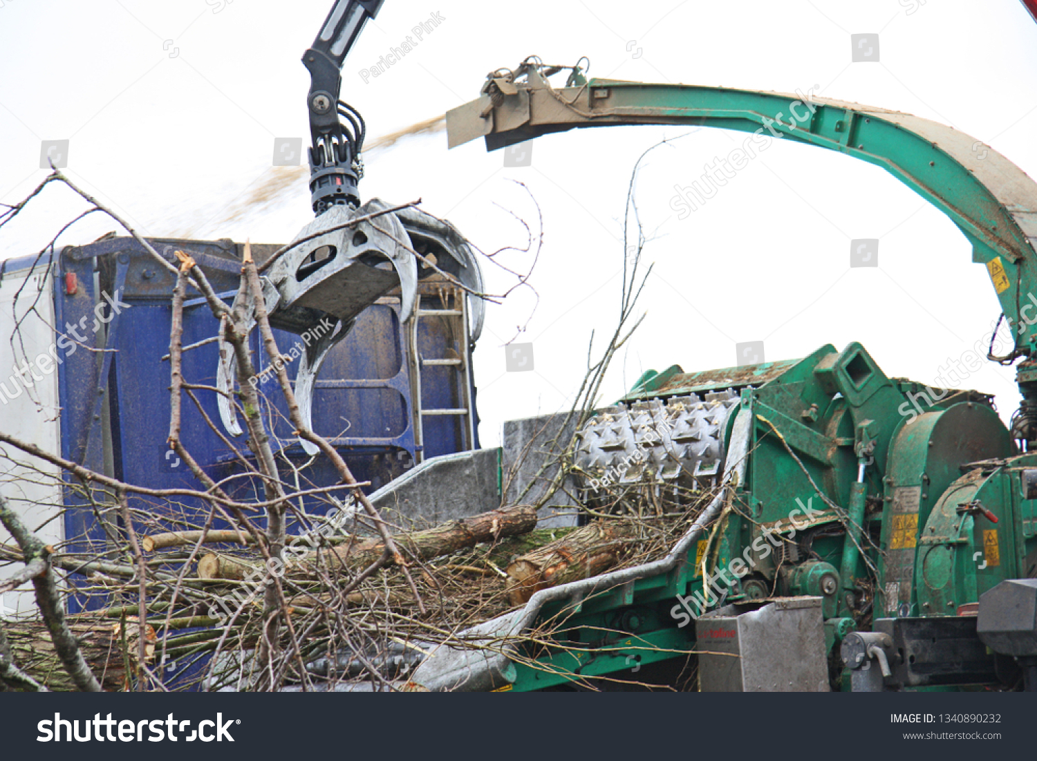 Branching machine, crane, crushing a branch in farm #1340890232